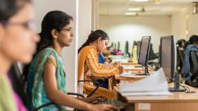young-indian-woman-working-at-a-computer
